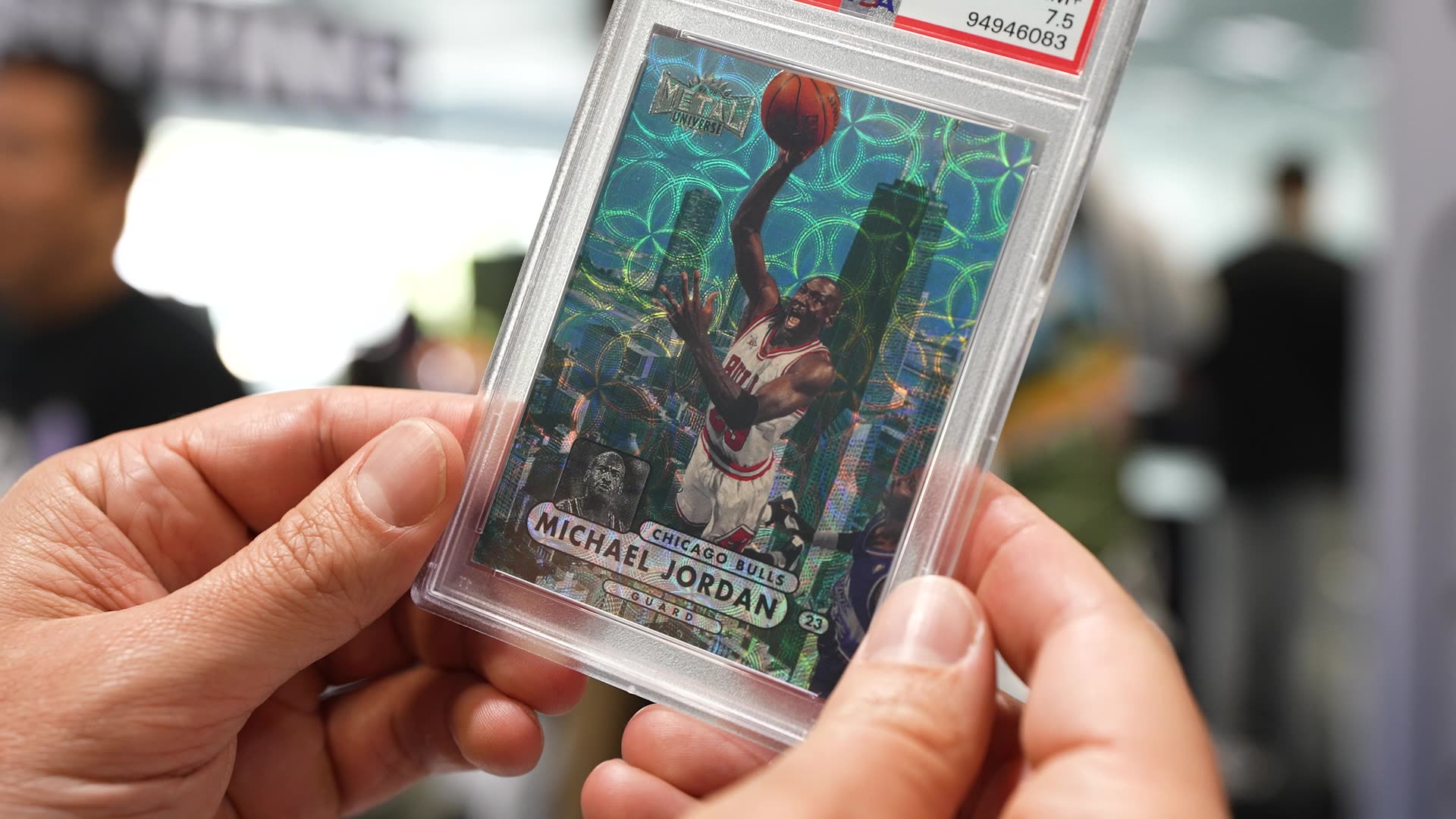 PSA-graded card held up — representing the show's grading partners